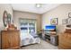 Cozy bedroom with double bed, TV, and ample storage at 6650 100Th N Way # 25C, St Petersburg, FL 33708