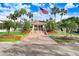 Community building with landscaping and flagpole at 6650 100Th N Way # 25C, St Petersburg, FL 33708