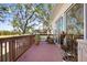 Spacious deck with wooden railing and potted plants at 6650 100Th N Way # 25C, St Petersburg, FL 33708