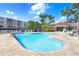 Community pool with plenty of lounge chairs at 6650 100Th N Way # 25C, St Petersburg, FL 33708