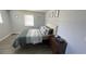 Cozy bedroom with a double bed and plenty of space at 2205 Mcgee Rd, Plant City, FL 33565
