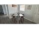 Small dining area with glass table and four chairs at 2205 Mcgee Rd, Plant City, FL 33565