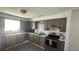 Galley kitchen with stainless steel appliances and ample cabinet space at 2205 Mcgee Rd, Plant City, FL 33565