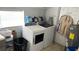 Laundry room with washer, dryer, and additional storage at 2205 Mcgee Rd, Plant City, FL 33565