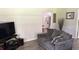 Living room with gray couch and view into dining area at 2205 Mcgee Rd, Plant City, FL 33565