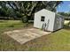 Metal storage shed with concrete slab and yard space at 2205 Mcgee Rd, Plant City, FL 33565