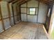 Unfinished interior of a metal storage shed with insulation at 2205 Mcgee Rd, Plant City, FL 33565