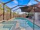 Inviting pool area with spa and covered patio at 10395 Boyette Brook St, Riverview, FL 33569