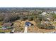 Wide aerial view of the property and surrounding houses and landscape at 4039 Meadow Run Ln, Wesley Chapel, FL 33543