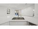 Modern kitchen island with white quartz countertop and stainless steel sink at 4039 Meadow Run Ln, Wesley Chapel, FL 33543