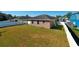 Large backyard with grassy area, privacy fence, and view of neighboring houses at 2729 Walden Woods Dr, Plant City, FL 33566