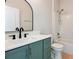 Bathroom with green vanity, black fixtures, and a shower/tub combo at 2729 Walden Woods Dr, Plant City, FL 33566