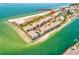 Aerial view of a waterfront community with beach access and lush landscaping at 7532 Bayshore Dr # 203, Treasure Island, FL 33706