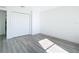 Bright bedroom with grey vinyl flooring and spacious closet at 9150 Genesee St, Port Charlotte, FL 33981