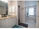 Bathroom with double vanity, soaking tub, and separate shower at 4126 Cobbler Ln, North Port, FL 34286