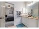 Bathroom with double vanity and view of bedroom at 4126 Cobbler Ln, North Port, FL 34286