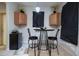 Small breakfast nook with table and chairs near the kitchen at 4126 Cobbler Ln, North Port, FL 34286