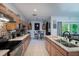 Updated kitchen with light wood cabinets and an island at 4126 Cobbler Ln, North Port, FL 34286