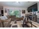 Relaxing living room with large windows and comfortable seating at 4126 Cobbler Ln, North Port, FL 34286