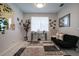 Cozy sitting area with a small sofa and decorative elements at 4126 Cobbler Ln, North Port, FL 34286