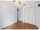 Simple bedroom with wood floors and ceiling fan at 1909 River Crossing Dr, Valrico, FL 33596