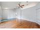 Spacious living room featuring hardwood floors and ceiling fan at 1909 River Crossing Dr, Valrico, FL 33596