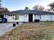 Single-story house with attached garage and front yard at 1906 Twisting Ln, Wesley Chapel, FL 33543