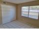 Bedroom showcases a window with blinds and a closet with sliding doors at 4885 Rilma Ave # 130, Sarasota, FL 34234