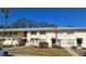 Inviting two-story condo with well-maintained landscaping and palm trees at 4885 Rilma Ave # 130, Sarasota, FL 34234