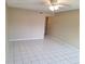 Open living room area featuring tile flooring and neutral wall paint at 4885 Rilma Ave # 130, Sarasota, FL 34234