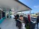 Outdoor kitchen area under covered patio overlooking the water at 4903 Shell Stream Blvd, New Port Richey, FL 34652