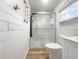 Clean bathroom with glass shower, toilet, and white vanity at 7326 Shepherd St, Sarasota, FL 34243