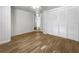 Bedroom with wood flooring and large closet with bi-fold doors at 7326 Shepherd St, Sarasota, FL 34243