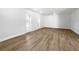 Spacious bedroom with laminate flooring and plantation shutters on the windows at 7326 Shepherd St, Sarasota, FL 34243