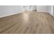 Light hardwood floors throughout an open living space at 7326 Shepherd St, Sarasota, FL 34243