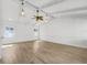 Living room with vaulted ceilings, wood flooring, and ceiling fan at 7326 Shepherd St, Sarasota, FL 34243