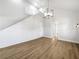 Open loft area with shiplap wall and hardwood floors at 7326 Shepherd St, Sarasota, FL 34243