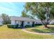 Cute ranch home with a landscaped lawn and a large shade tree at 7710 Danube Dr # A, Hudson, FL 34667