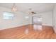 Bright living room with laminate flooring and sliding doors to a screened porch at 7710 Danube Dr # A, Hudson, FL 34667