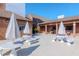 Community patio with tables, umbrellas, and seating at 7710 Danube Dr # A, Hudson, FL 34667