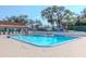 Inviting community pool with lounge chairs at 7710 Danube Dr # A, Hudson, FL 34667