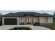 Modern home exterior with a 2-car garage and landscaped front yard at 1405 Point Of Pines, Englewood, FL 34223