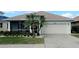 Beautiful home with a well-maintained lawn and screened porch at 1835 Scarlett Ave, North Port, FL 34289