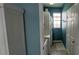 Laundry room with washer, dryer, utility sink, and built-in cabinets at 1835 Scarlett Ave, North Port, FL 34289