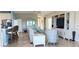 Spacious living area featuring a comfortable seating arrangement and built-in entertainment center at 1835 Scarlett Ave, North Port, FL 34289
