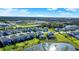 Beautiful aerial view of the neighborhood, pond, and community area, showing many single Gathering homes at 9189 Royal River Cir, Parrish, FL 34219