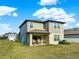 Beautiful backyard featuring a covered patio, lush lawn, and inviting outdoor space at 9189 Royal River Cir, Parrish, FL 34219