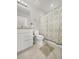 Clean bathroom featuring a shower with patterned curtain, toilet, and vanity with marble counter at 9189 Royal River Cir, Parrish, FL 34219