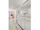 Bright, updated bathroom with a modern vanity and colorful shower curtain at 9189 Royal River Cir, Parrish, FL 34219