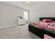 Cozy bedroom with gray carpet, ample natural light, and a comfortable bed at 9189 Royal River Cir, Parrish, FL 34219